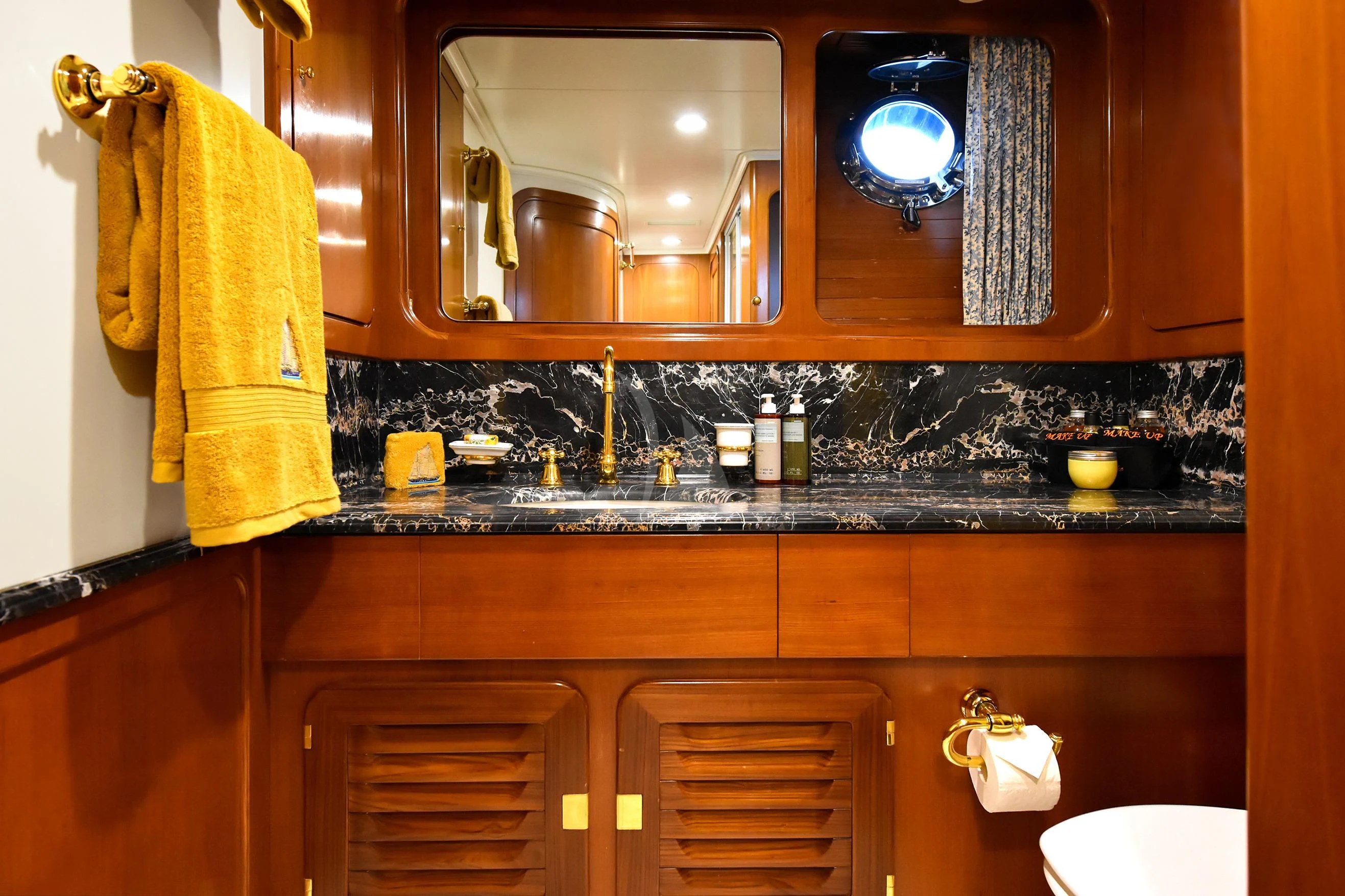 a kitchen with a sink and cabinets aboard TAMARITA Yacht for Sale