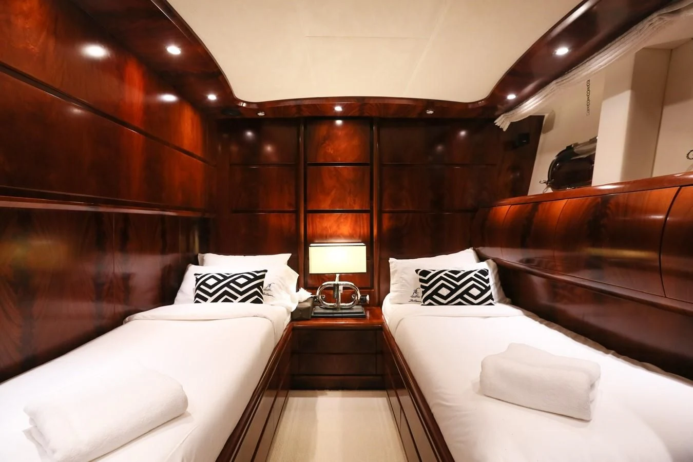 a room with a bed and a mirror aboard FOR YOUR EYES ONLY Yacht for Charter