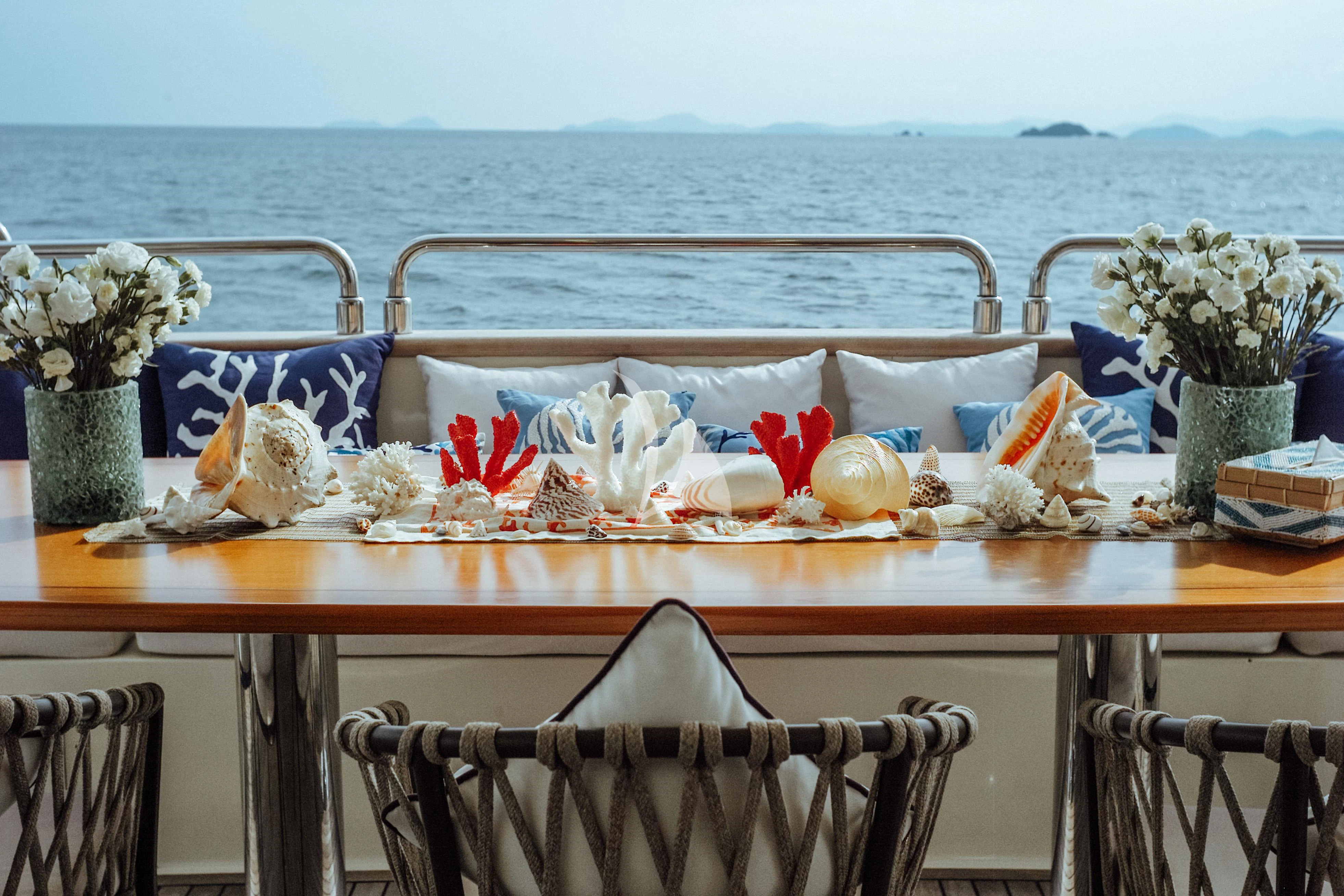 a table with food on it aboard FOR YOUR EYES ONLY Yacht for Charter