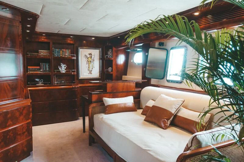 a room with a bed and a tv aboard FOR YOUR EYES ONLY Yacht for Charter