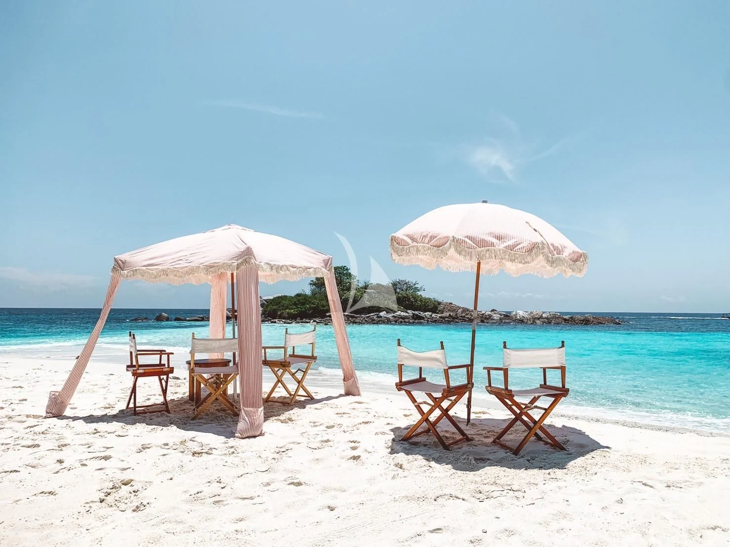 a group of chairs and umbrellas on a beach aboard FOR YOUR EYES ONLY Yacht for Charter
