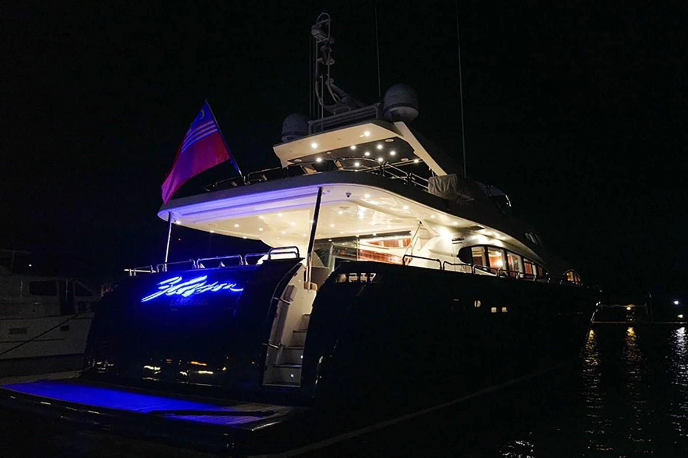 a boat with a flag on it aboard FOR YOUR EYES ONLY Yacht for Charter