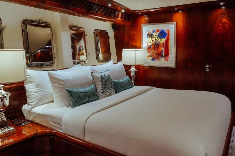 a bed with pillows and pillows aboard FOR YOUR EYES ONLY Yacht for Charter