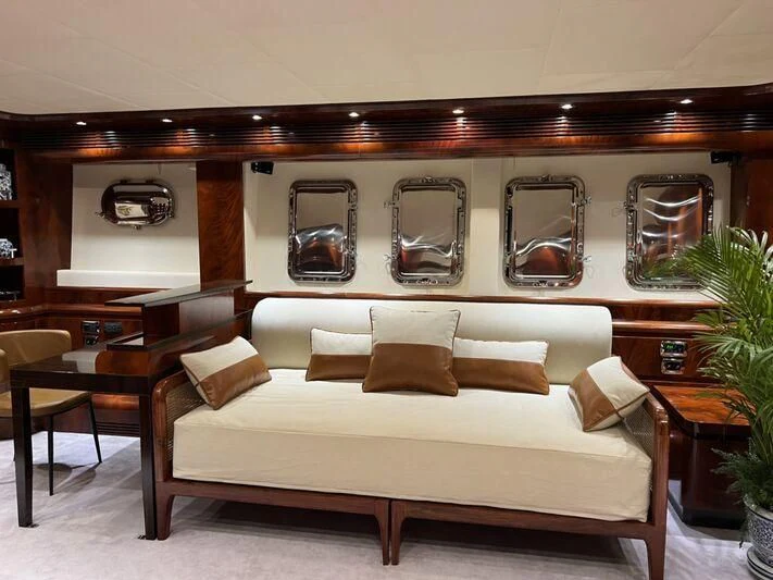 a living room with a couch and a table aboard FOR YOUR EYES ONLY Yacht for Charter