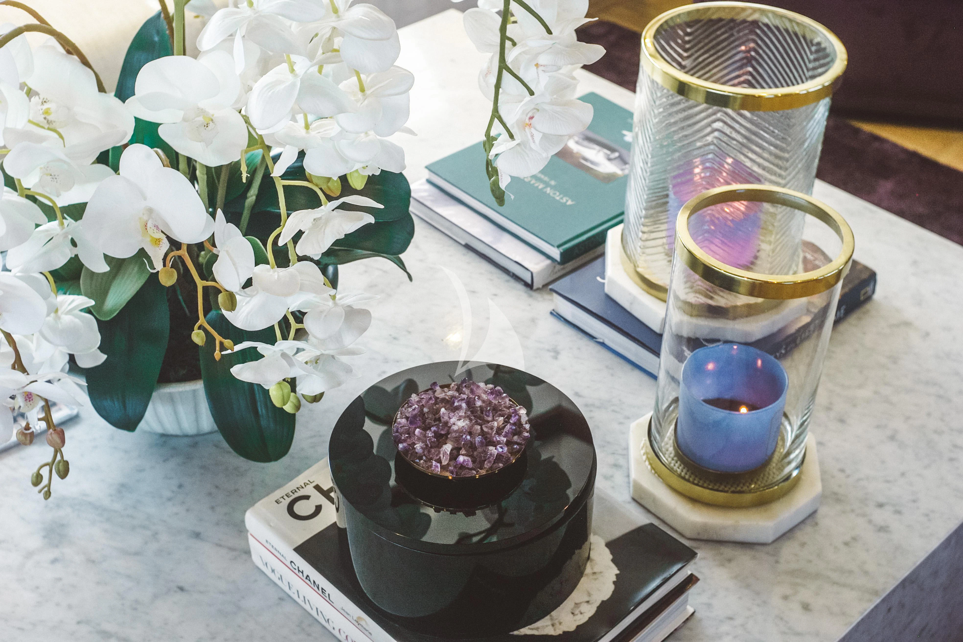 a table with a vase of flowers and candles aboard FOR YOUR EYES ONLY Yacht for Charter