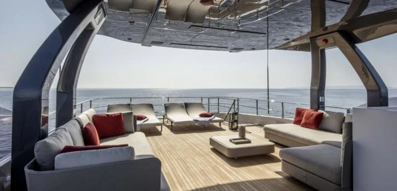 a large room with a large bed and a table aboard HAIAMI I Yacht for Charter