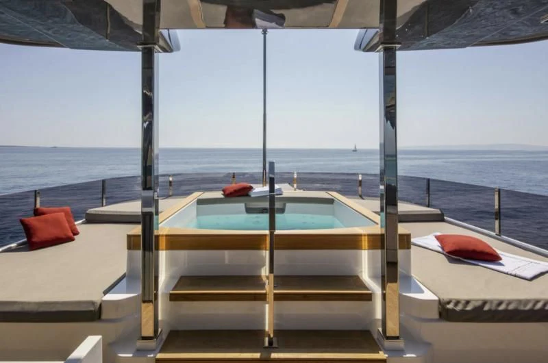 a lounge chair on a beach aboard HAIAMI I Yacht for Charter