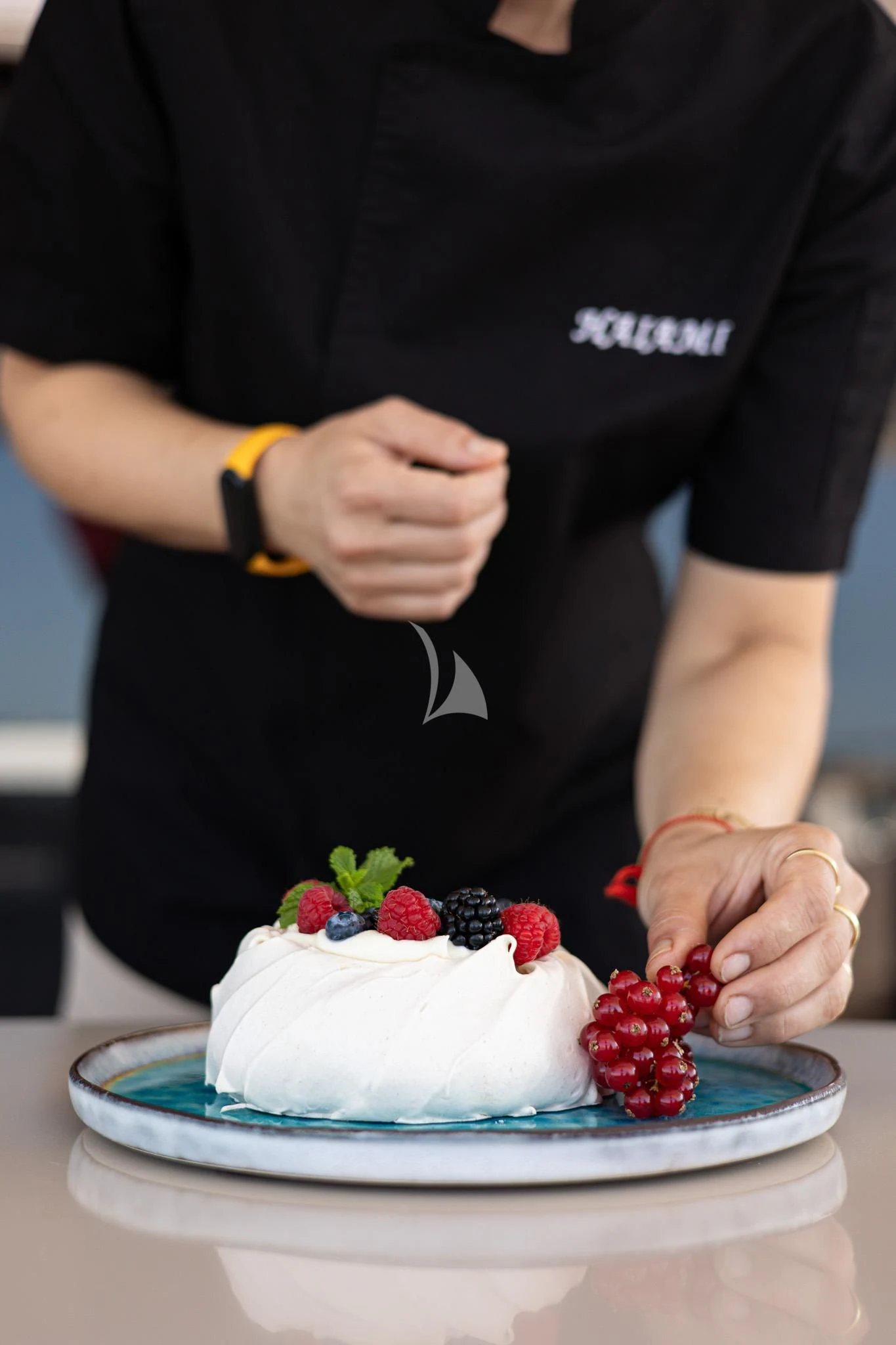a person cutting a cake aboard HAIAMI I Yacht for Charter