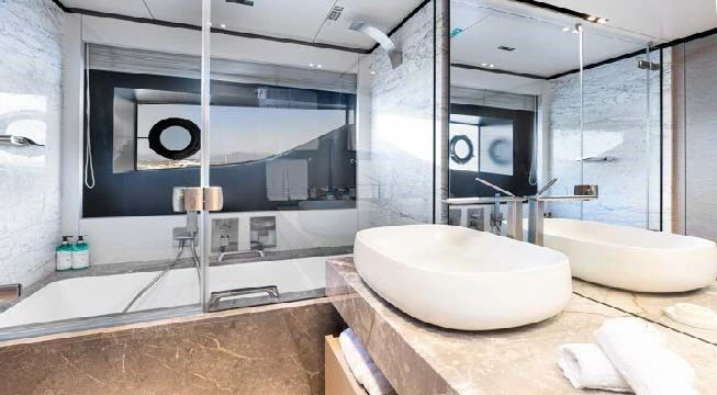 a bathroom with a large glass shower aboard HAIAMI I Yacht for Charter