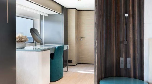 a room with a desk and a chair aboard HAIAMI I Yacht for Charter