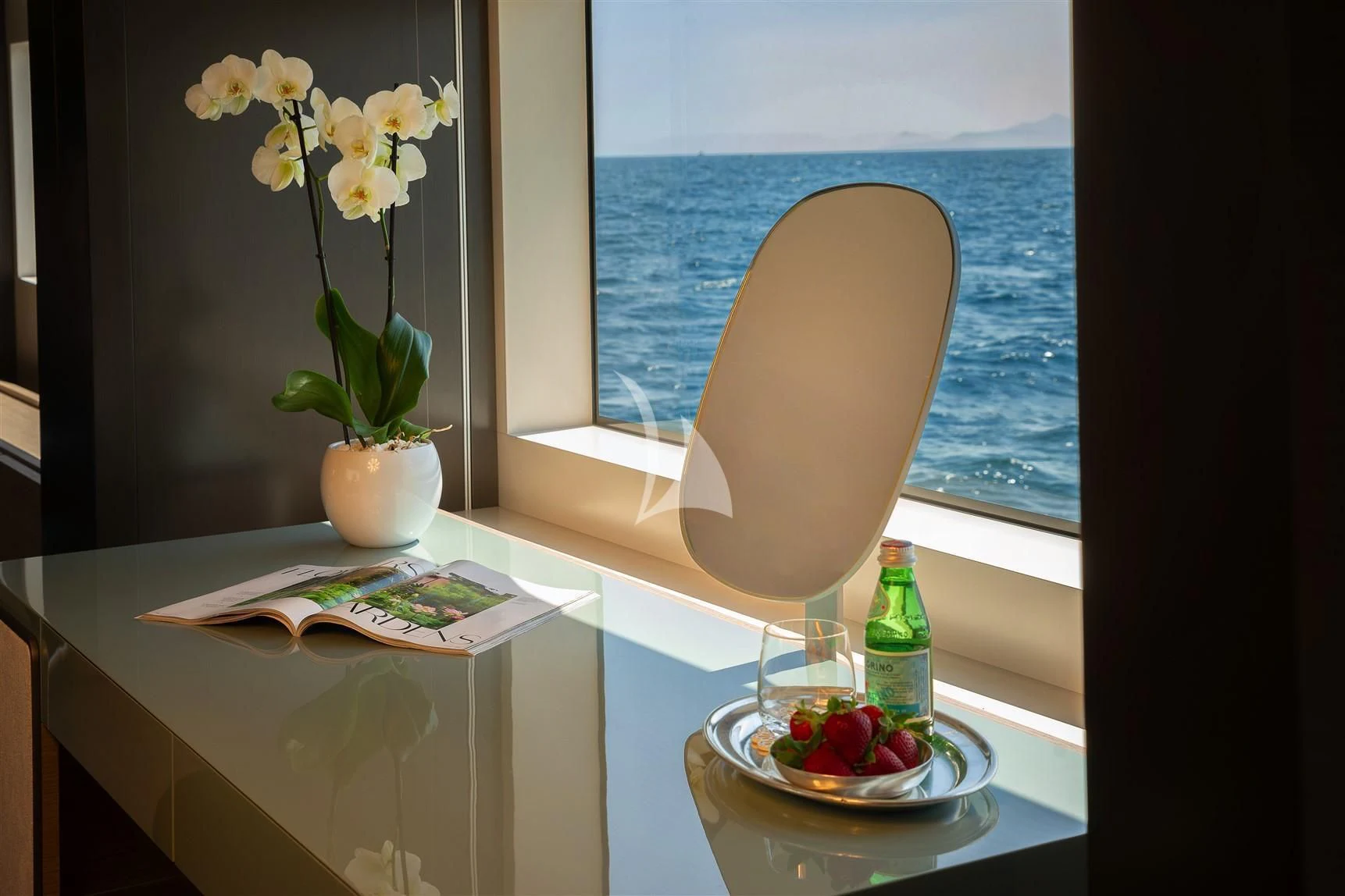 a vase of flowers next to a window aboard HAIAMI I Yacht for Charter