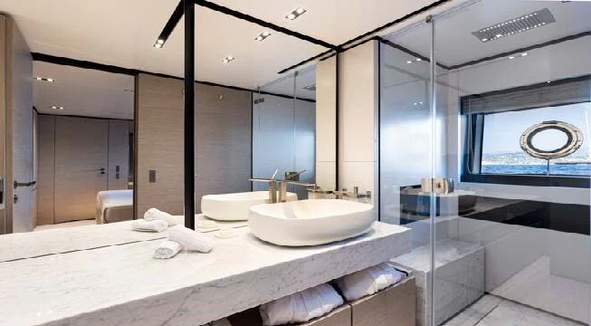 a bathroom with a large mirror aboard HAIAMI I Yacht for Charter