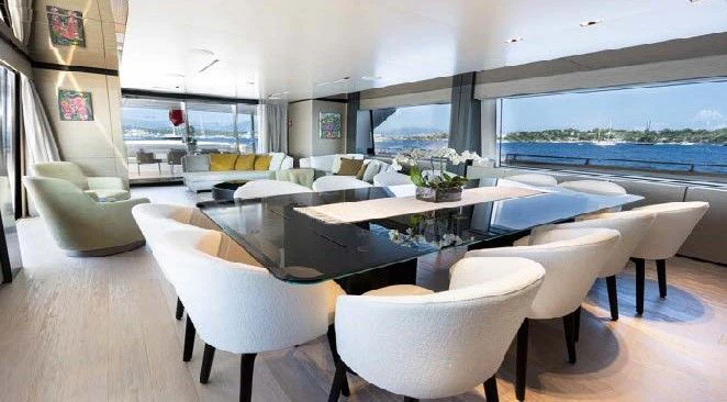 a room with a table and chairs aboard HAIAMI I Yacht for Charter