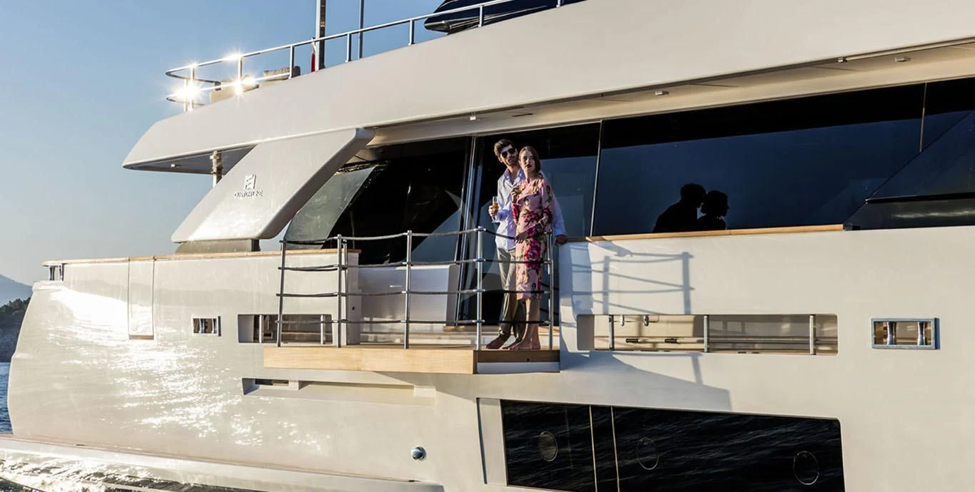 a couple of women standing on a boat aboard HAIAMI I Yacht for Charter
