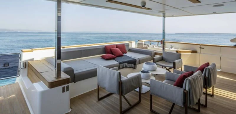 a large living room with a view of the ocean aboard HAIAMI I Yacht for Charter