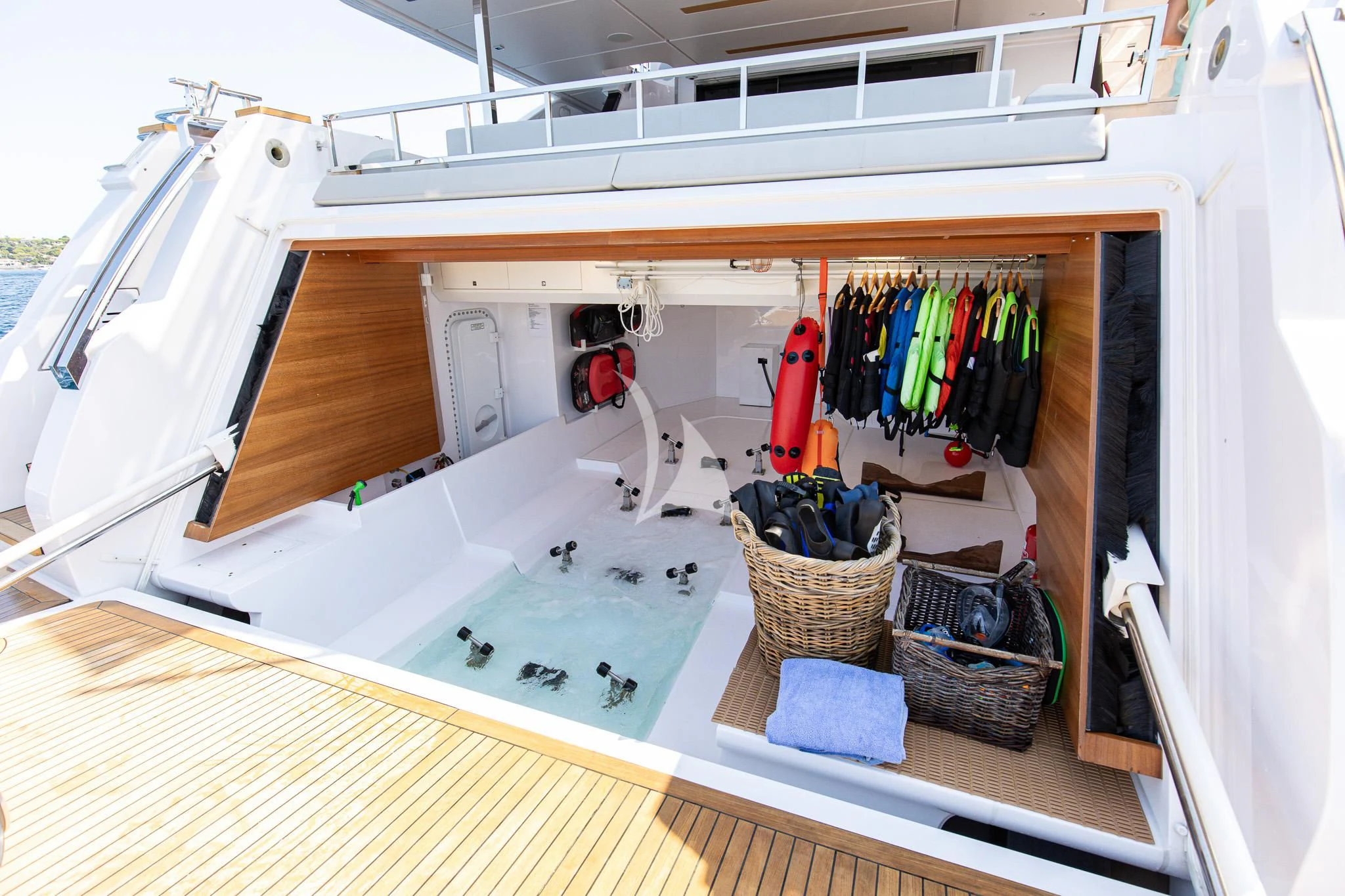 a white and yellow laundry room aboard HAIAMI I Yacht for Charter