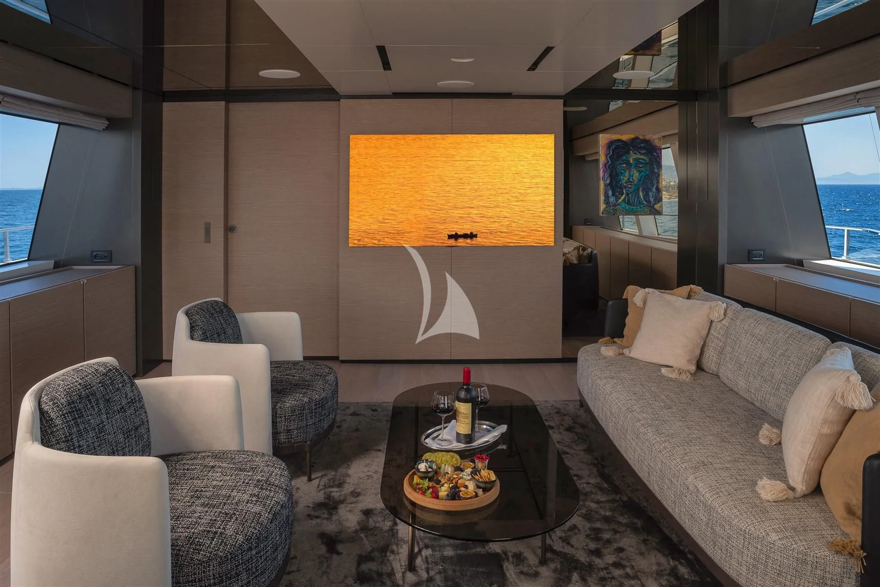 a living room with a large screen aboard HAIAMI I Yacht for Charter
