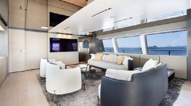 a living room with a couch and a tv aboard HAIAMI I Yacht for Charter