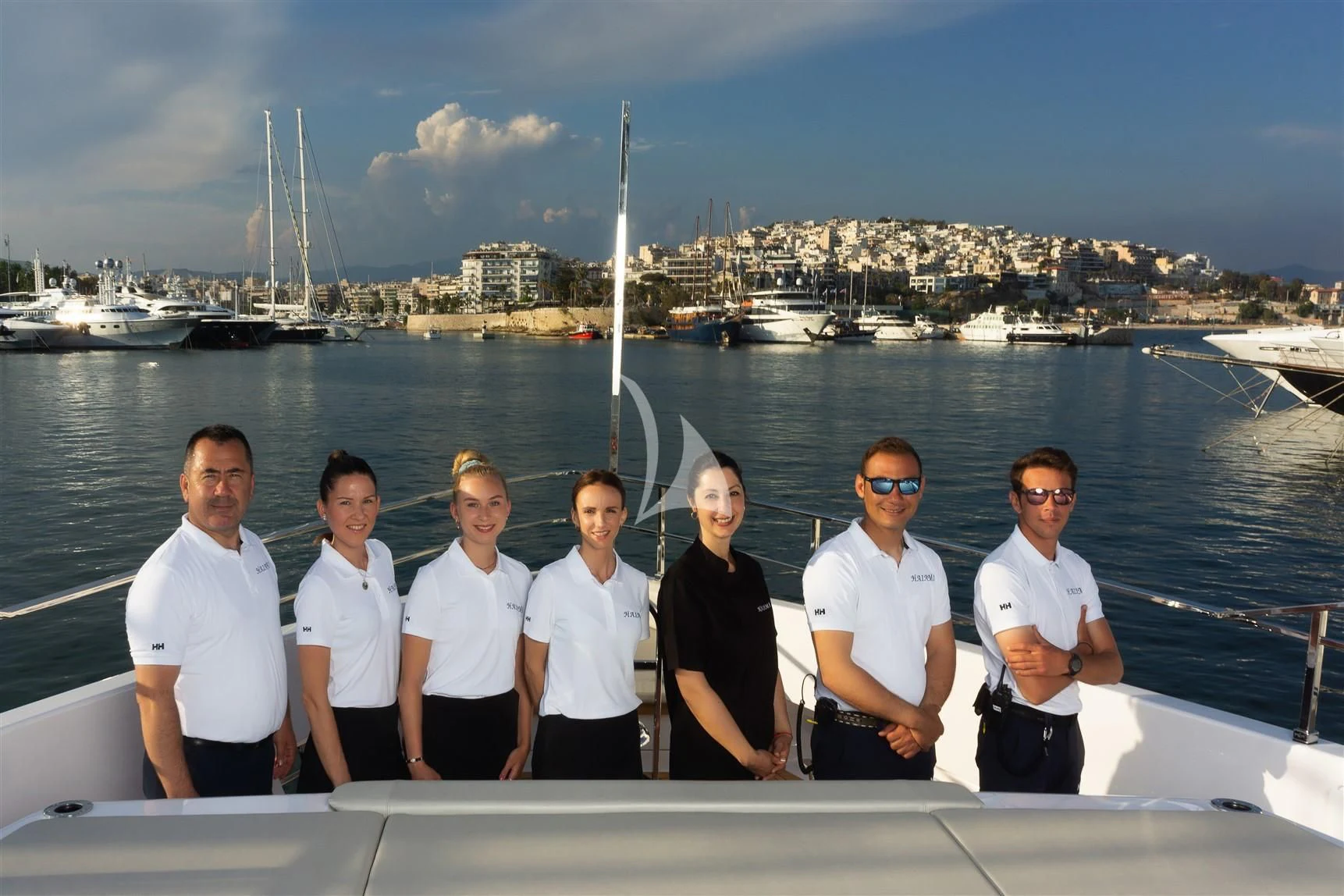 a group of people posing for a photo on a boat aboard HAIAMI I Yacht for Charter
