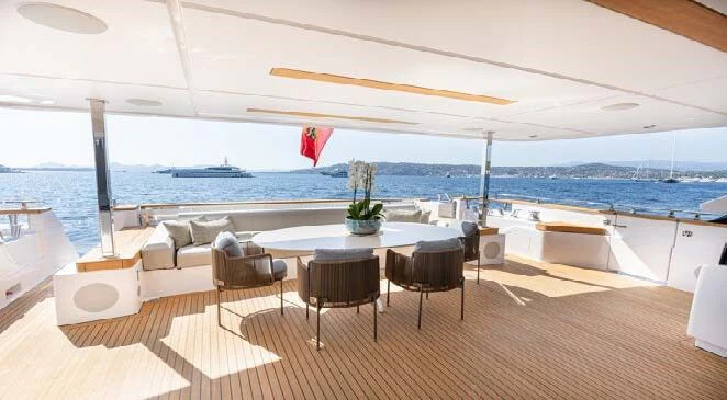 a table and chairs on a deck aboard HAIAMI I Yacht for Charter