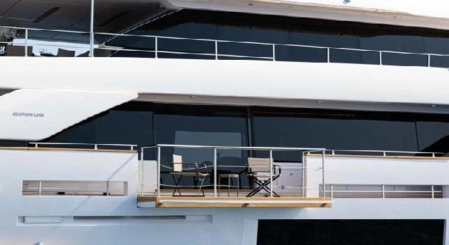 a large white building with a balcony aboard HAIAMI I Yacht for Charter