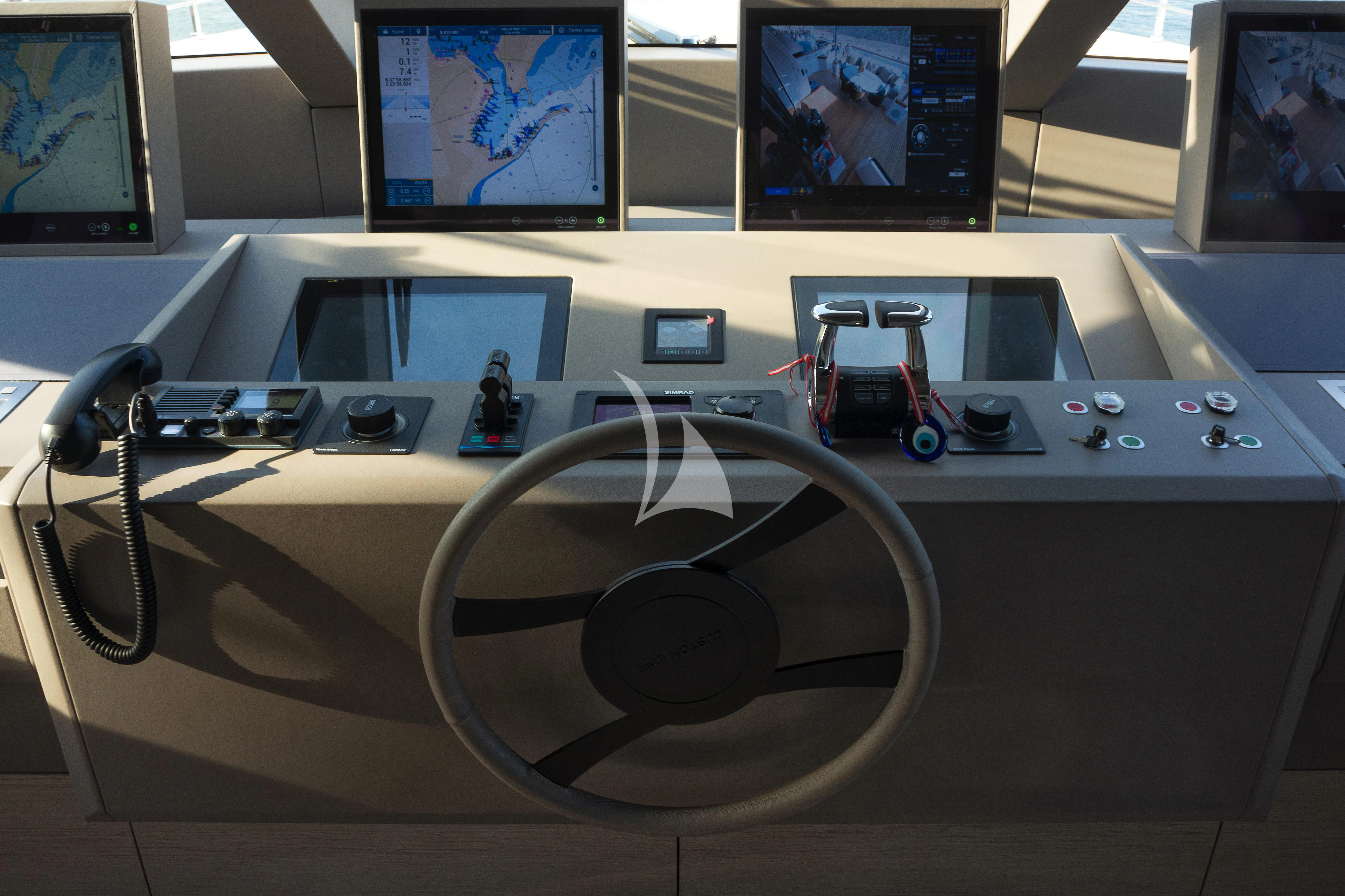 a table with a fan and a video game console on it aboard HAIAMI I Yacht for Charter