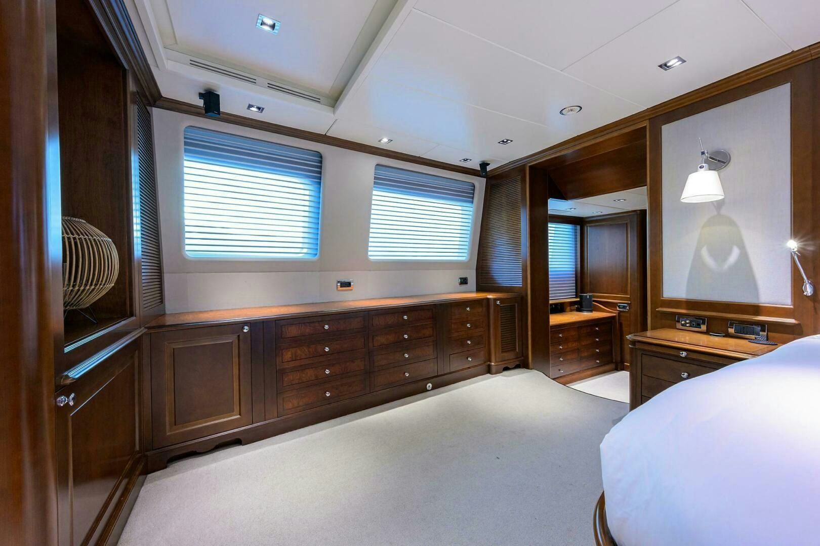 a bedroom with a bed and a dresser aboard ARTHUR’S WAY Yacht for Sale
