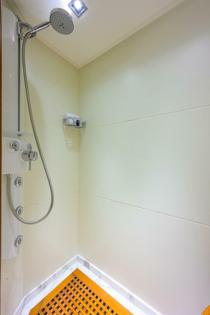a shower with a metal handle aboard ARTHUR’S WAY Yacht for Sale