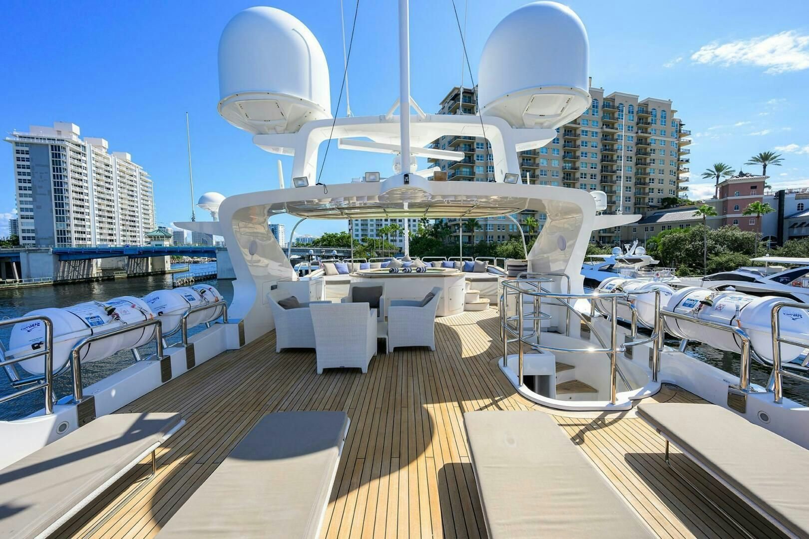 a deck with a large cruise ship in the background aboard ARTHUR’S WAY Yacht for Sale