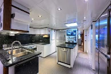 a kitchen with a large island aboard ARTHUR’S WAY Yacht for Sale