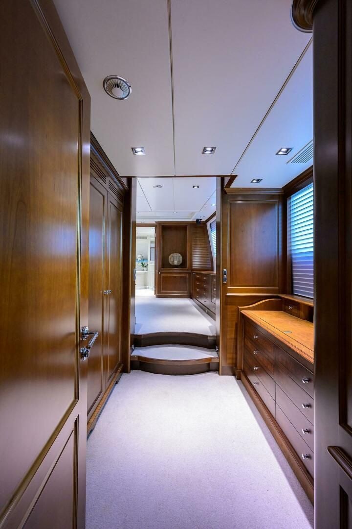 a hallway with wooden cabinets aboard ARTHUR’S WAY Yacht for Sale
