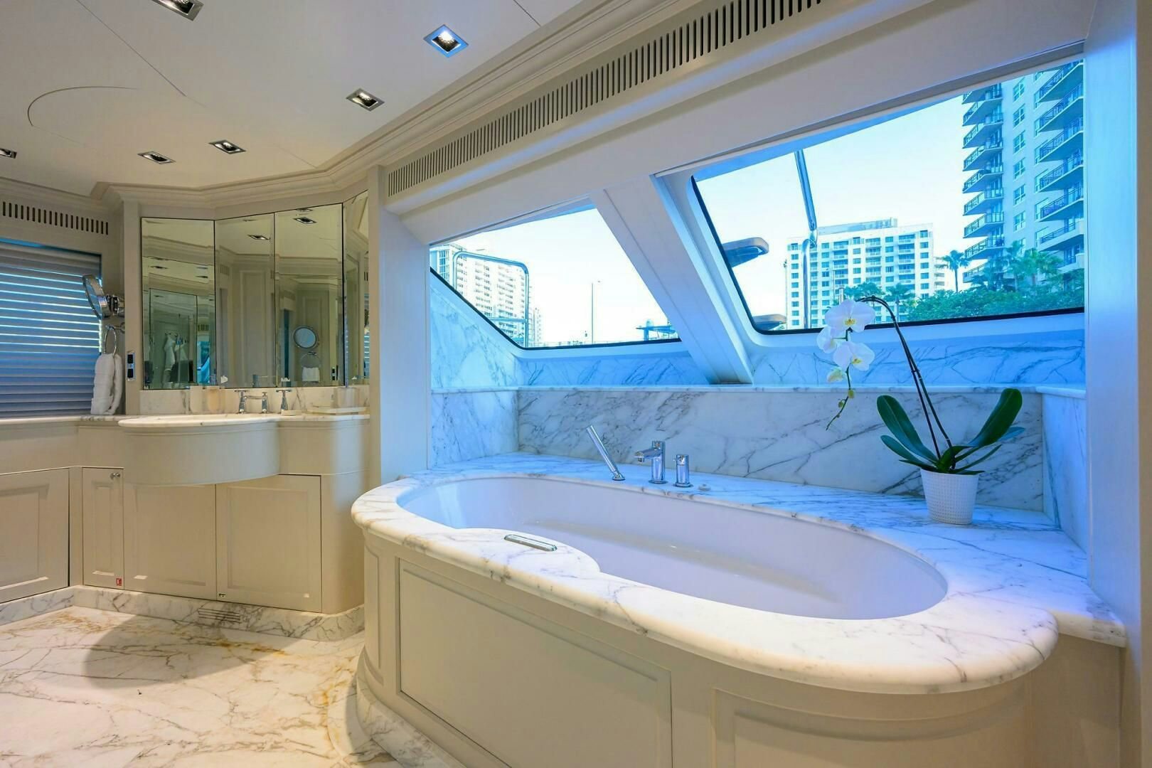 a large bathroom with a large tub aboard ARTHUR’S WAY Yacht for Sale