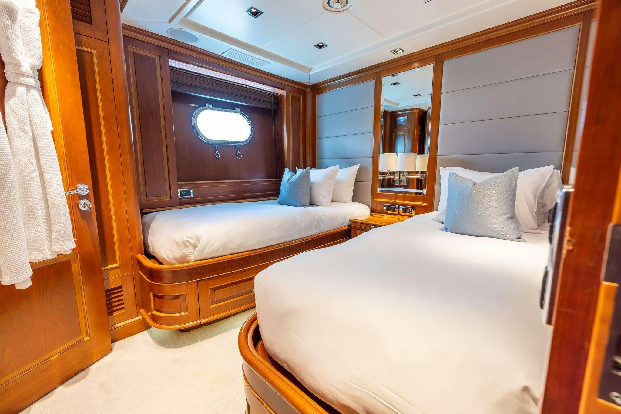 a room with two beds aboard ARTHUR’S WAY Yacht for Sale