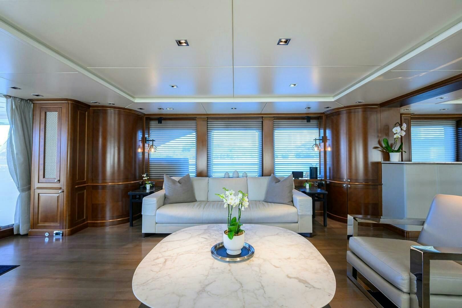 a living room with a table and chairs aboard ARTHUR’S WAY Yacht for Sale