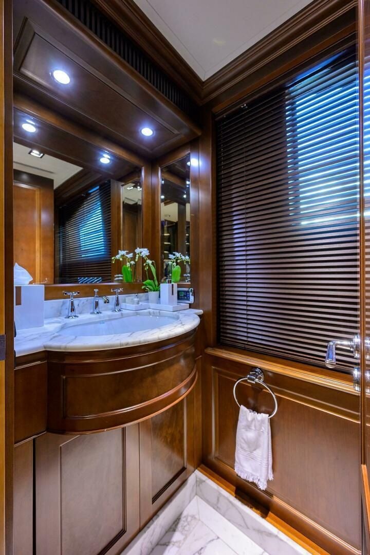 a bathroom with a sink and a bathtub aboard ARTHUR’S WAY Yacht for Sale