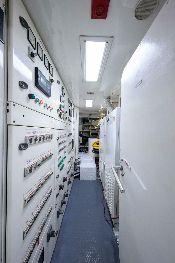 a hallway with white walls aboard ARTHUR’S WAY Yacht for Sale