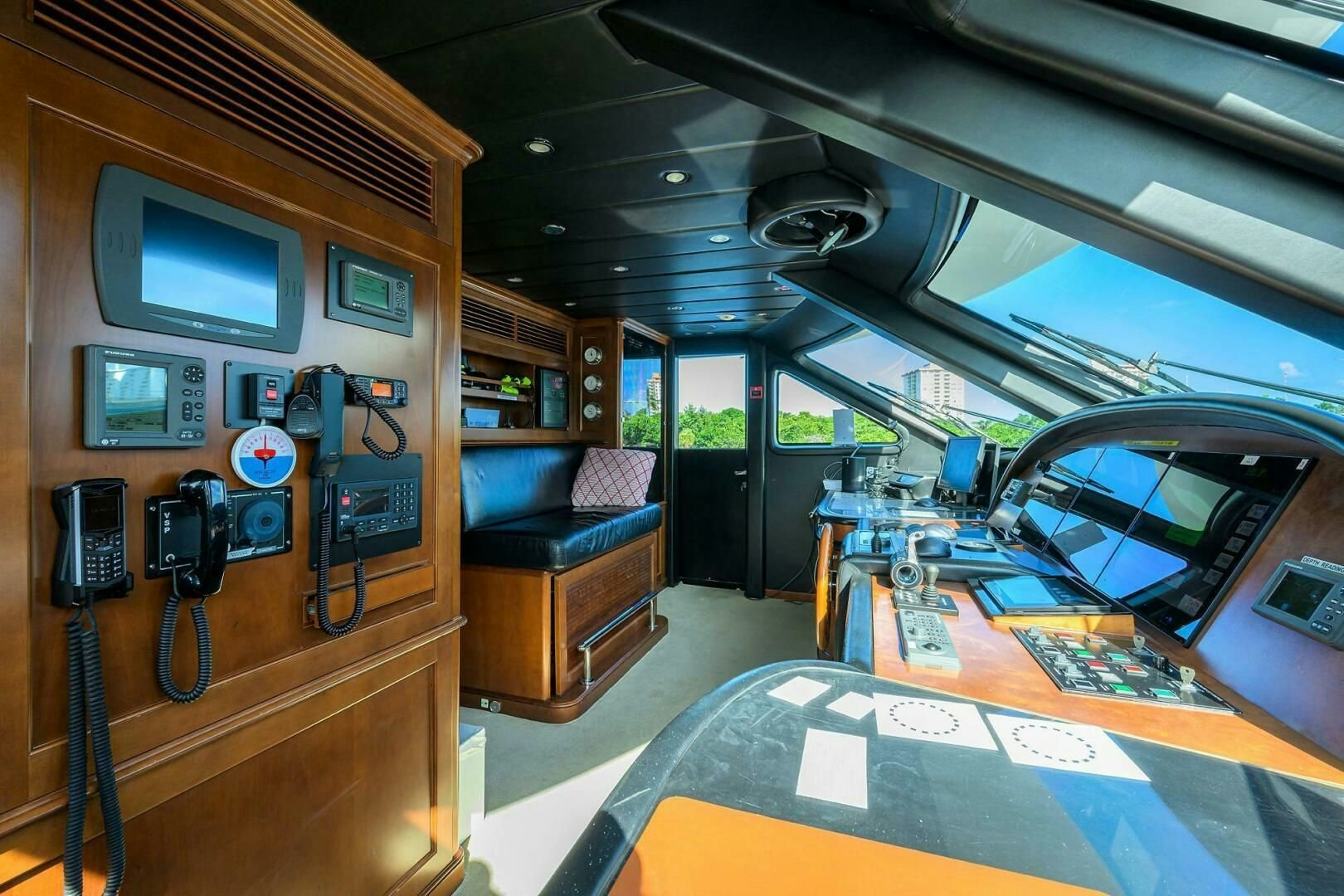 a room with a table and a television aboard ARTHUR’S WAY Yacht for Sale