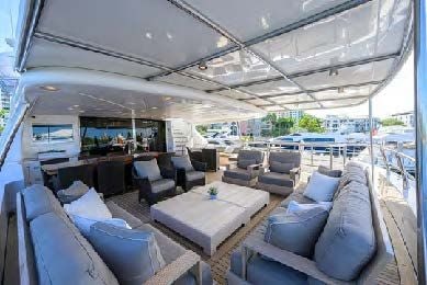 a large lounge area with a table and chairs aboard ARTHUR’S WAY Yacht for Sale