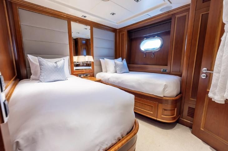 a room with two beds aboard ARTHUR’S WAY Yacht for Sale