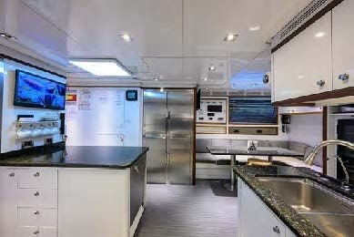 a kitchen with a large refrigerator aboard ARTHUR’S WAY Yacht for Sale