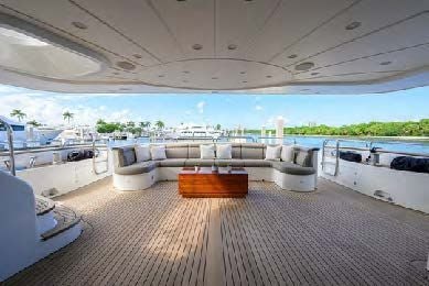 a large room with a large deck and a pool aboard ARTHUR’S WAY Yacht for Sale