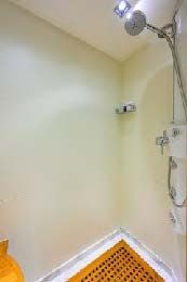 a shower with a light on the wall aboard ARTHUR’S WAY Yacht for Sale