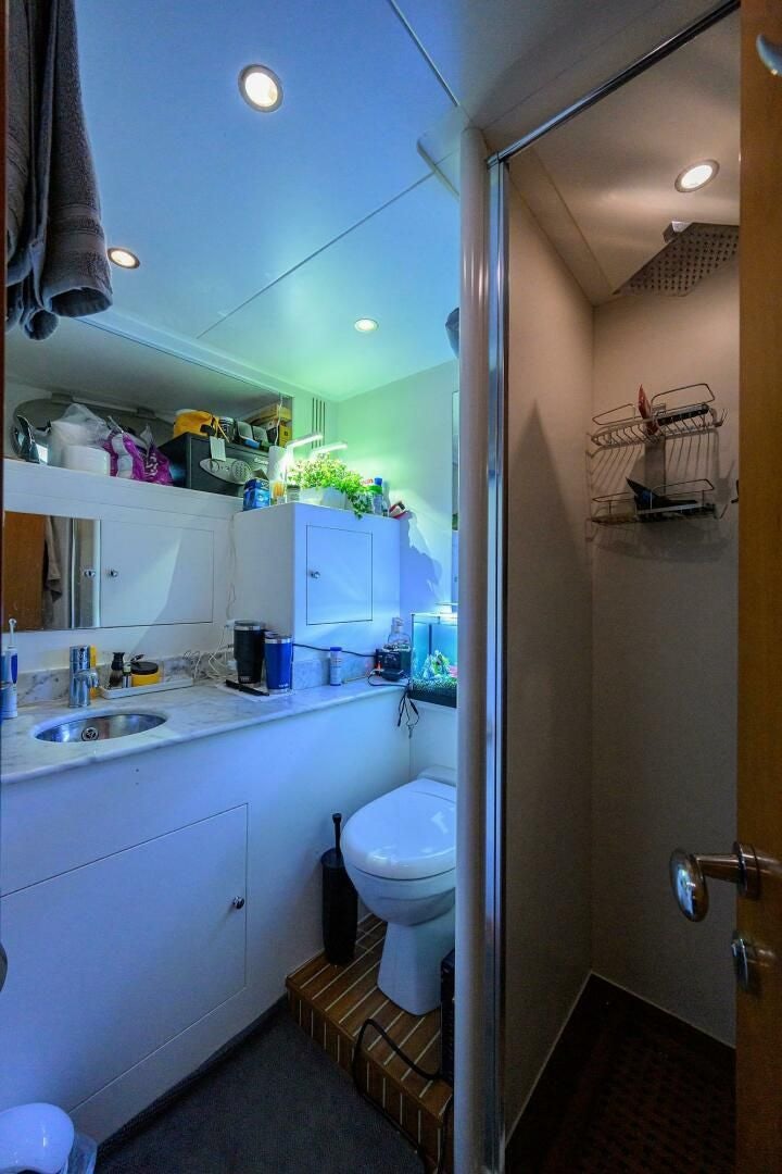 a bathroom with a toilet and sink aboard ARTHUR’S WAY Yacht for Sale