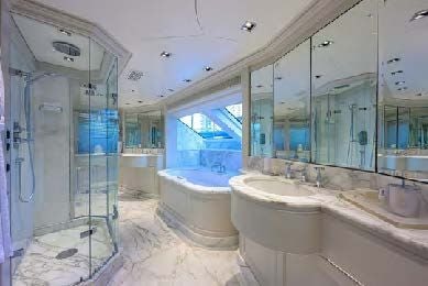 a bathroom with a bathtub and sink aboard ARTHUR’S WAY Yacht for Sale