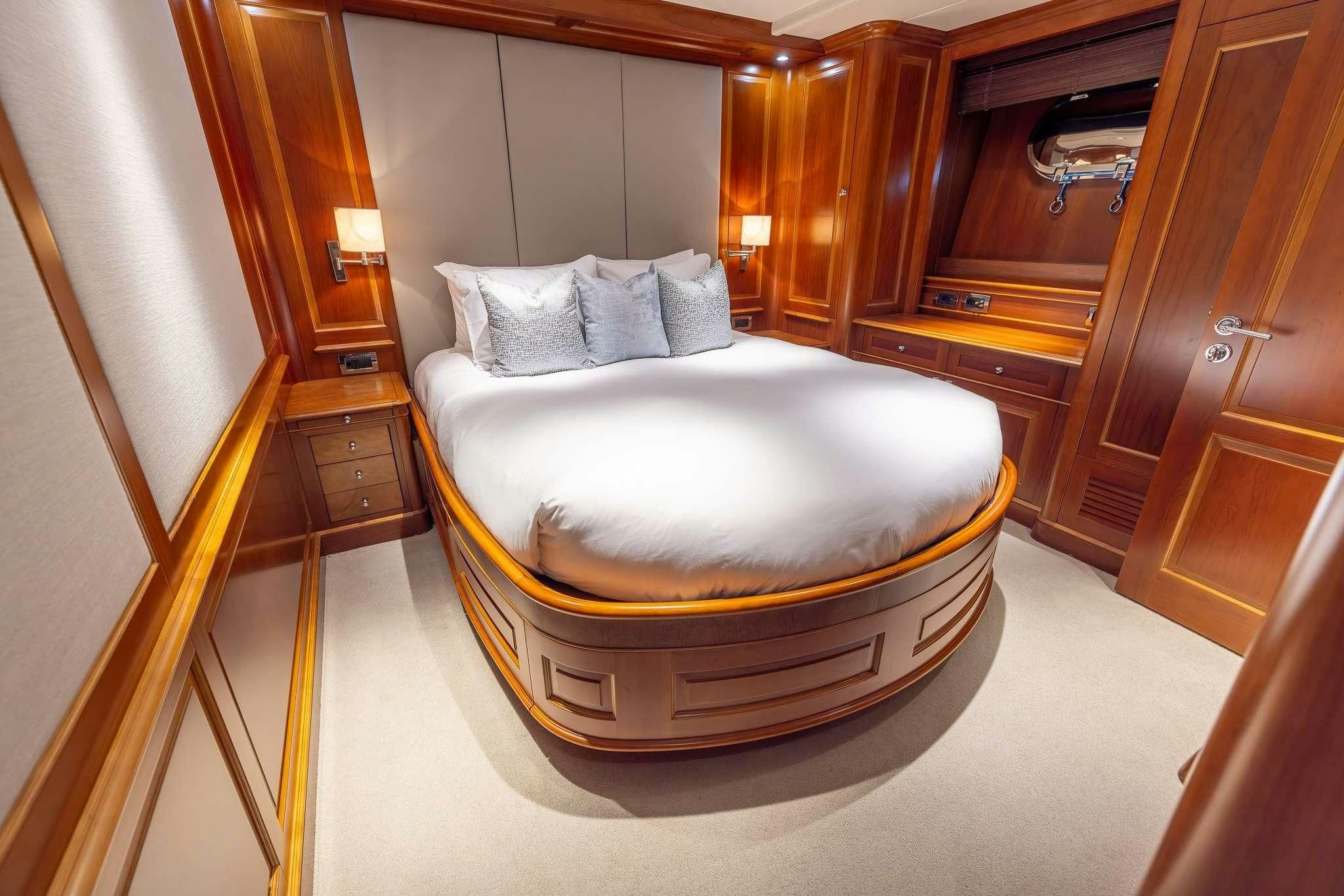 a bed in a room aboard ARTHUR’S WAY Yacht for Sale