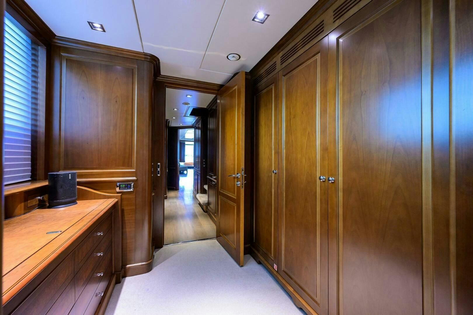 a hallway with wooden cabinets aboard ARTHUR’S WAY Yacht for Sale