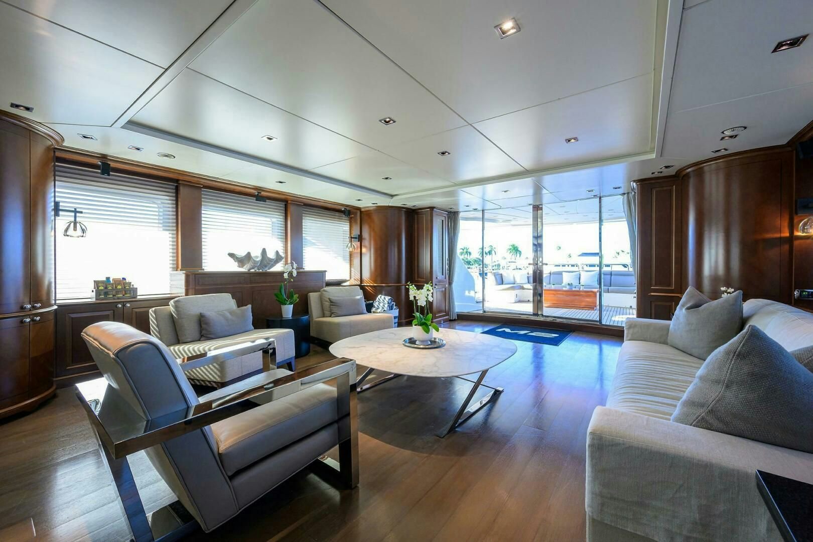 a living room with a large window aboard ARTHUR’S WAY Yacht for Sale