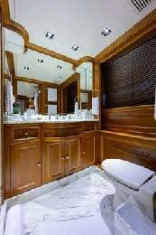 a bathroom with a large mirror aboard ARTHUR’S WAY Yacht for Sale