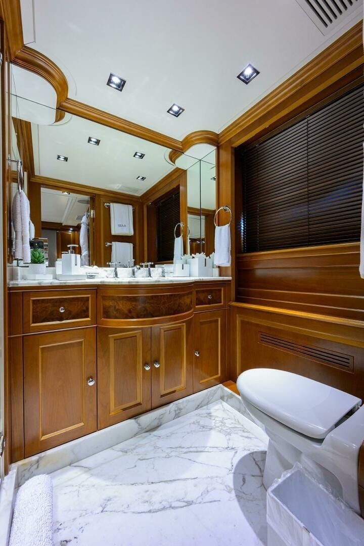 a bathroom with a large mirror aboard ARTHUR’S WAY Yacht for Sale