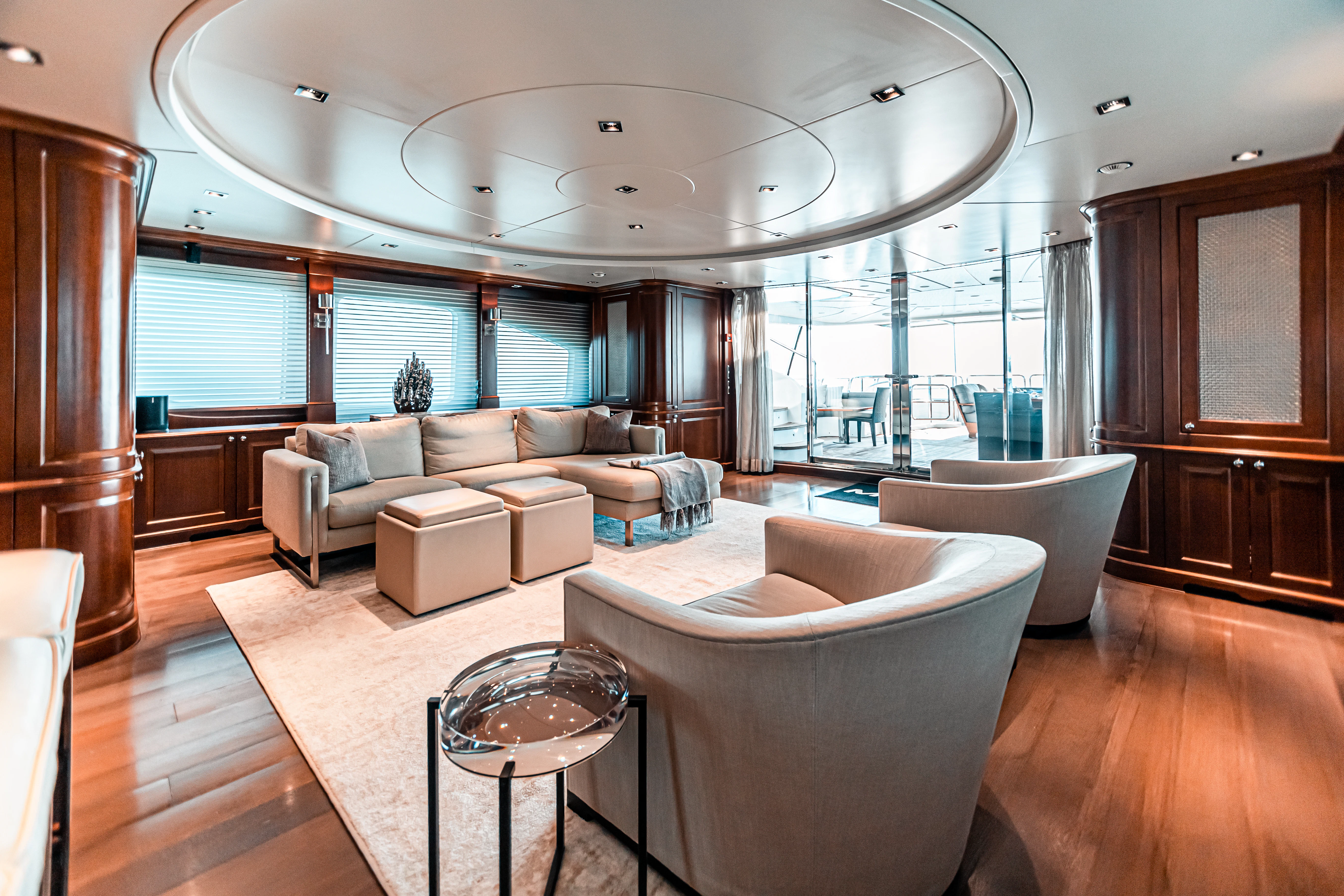 a living room with a large glass ceiling aboard ARTHUR’S WAY Yacht for Sale